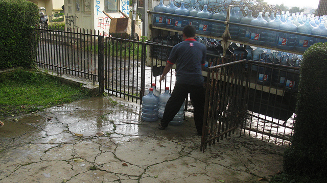 Home-delivered gallons of drinking water. (Credit: Ikhlasul Amal)