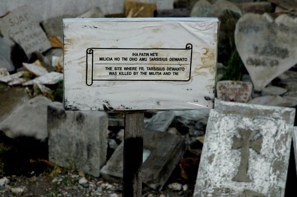 This plaque is next to the Suai Convent Chapel where a massacre led by militias took place in 1999 A problematic division